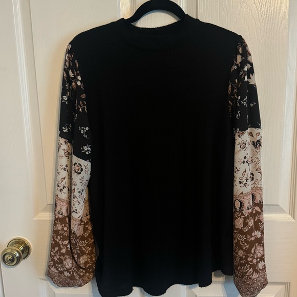 Maurices Tops - Black knit top with floral sleeves